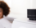 Close-up Of Black Wireless Speaker On Furniture