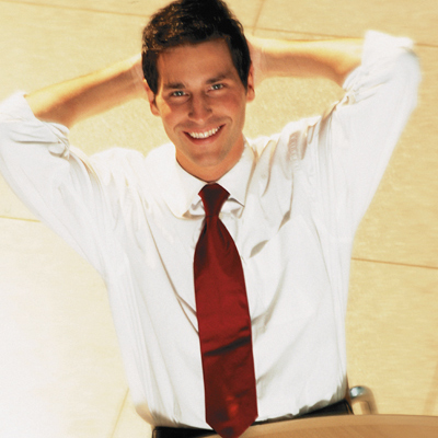 5 Tips to Minimize Downtime, pictured: relaxed IT professional