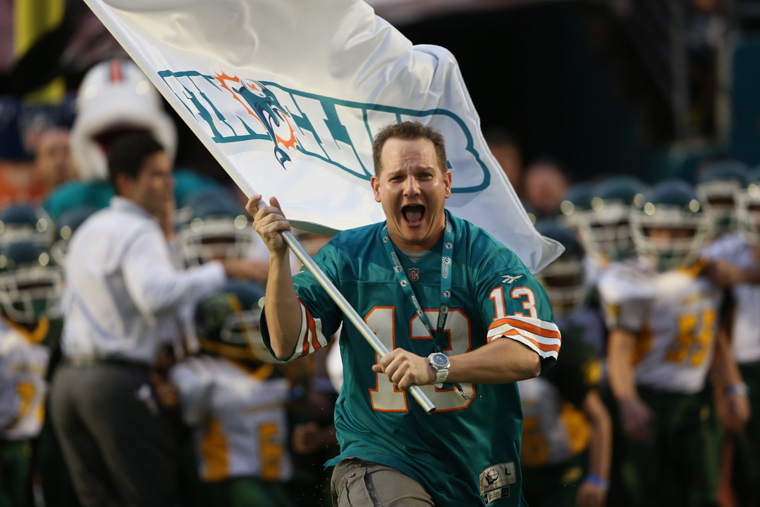 Miami Dolphins fan runs flag Miami Dolphins fan runs flag